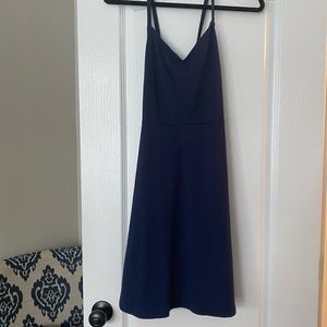 Navy blue dress with v-neck and criss-cross straps in back